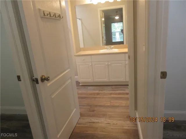 a view of an empty room and wooden floor