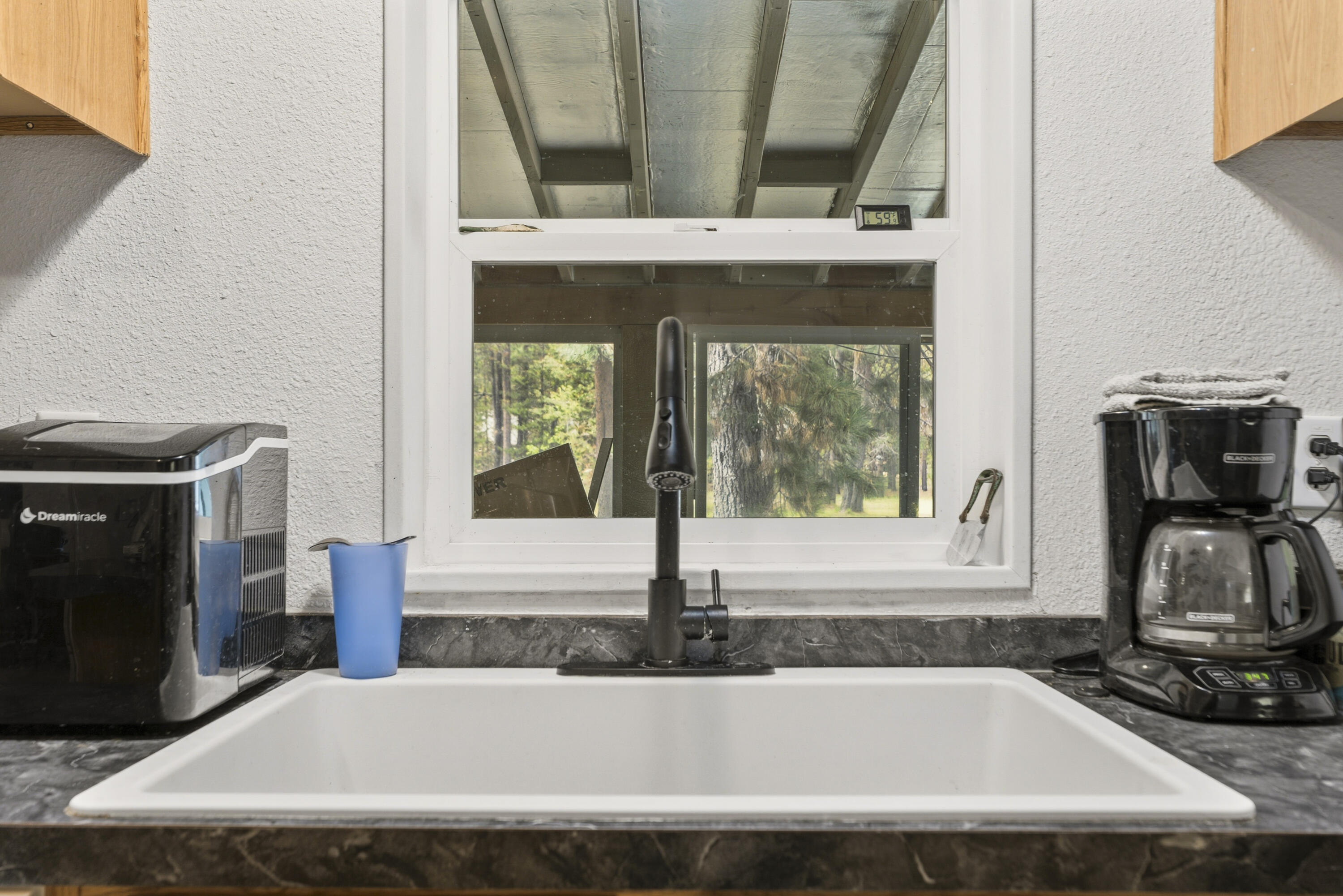 16928 Covina Road Bend, OR 97707 - Photo 14 of 48 a view of a bath tub sitting in a kitchen