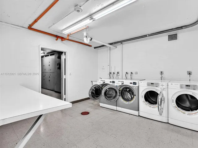 a view of swimming pool with outdoor seating and lake in the background