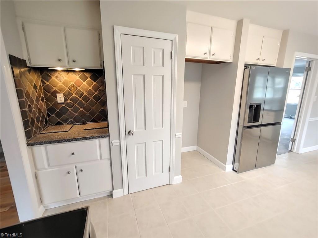 1602 Cherokee Drive High Point, NC 27262 - Photo 21 of 47 Kitchen with tile back splash, pantry & space for a full freezer & refrigerator or 2 refrigerator/freezer combos