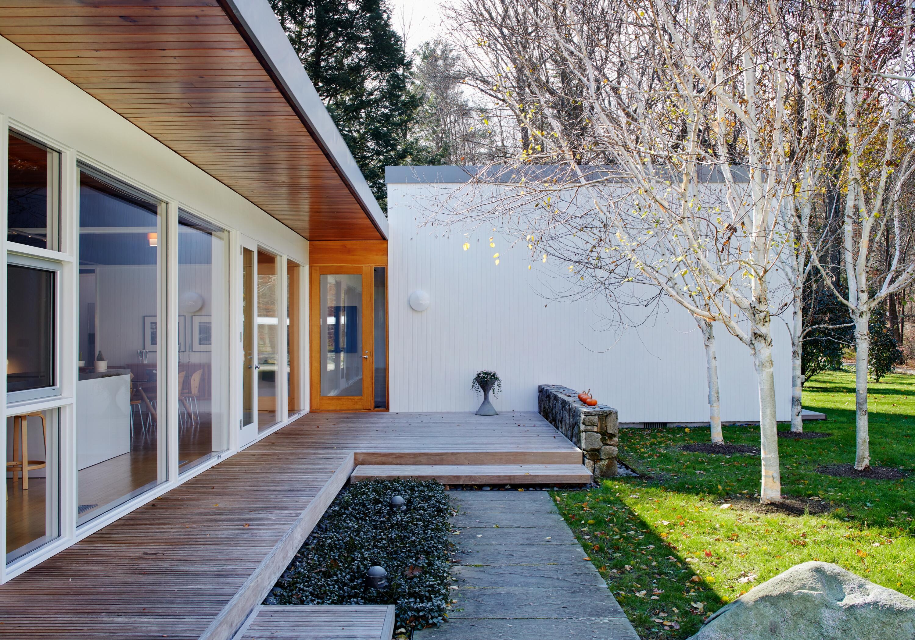 431 Valley Road New Canaan, CT 06840 - Photo 2 of 32 a front view of a house with garden