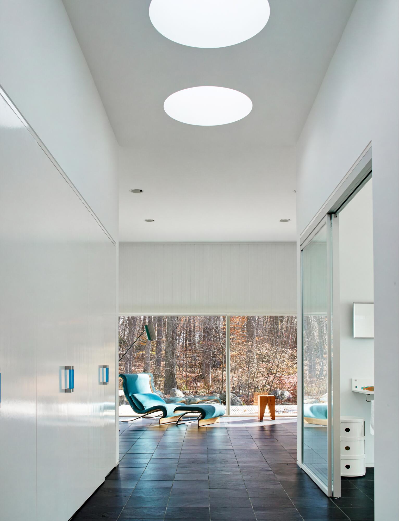 431 Valley Road New Canaan, CT 06840 - Photo 22 of 32 a living room with table and chairs