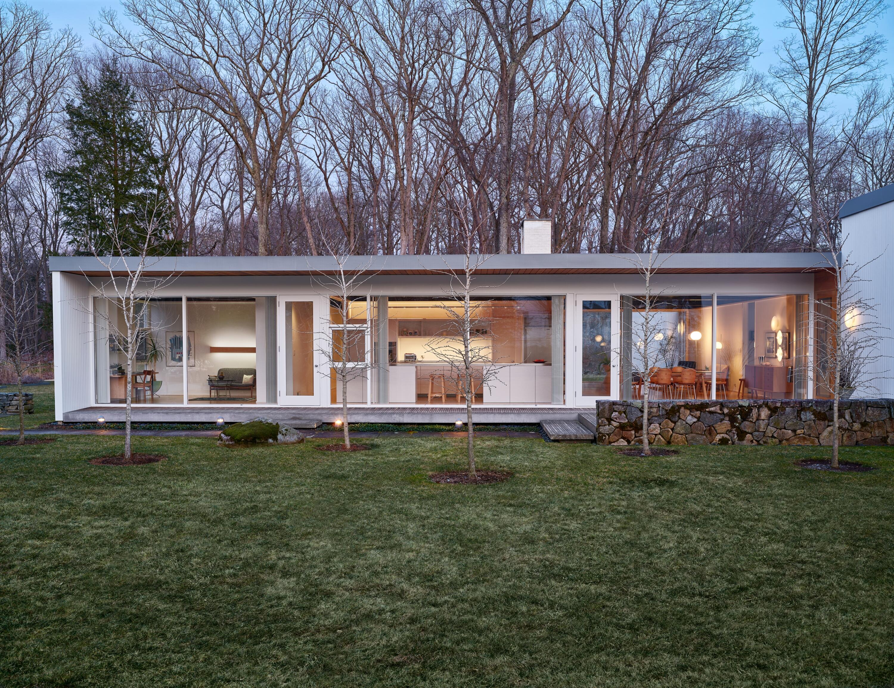 431 Valley Road New Canaan, CT 06840 - Photo 31 of 32 a front view of a house with a garden and porch
