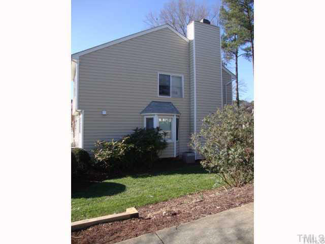 4145 Kaplan Drive Raleigh, NC 27606 - Photo 2 of 3 a front view of a house with a garden