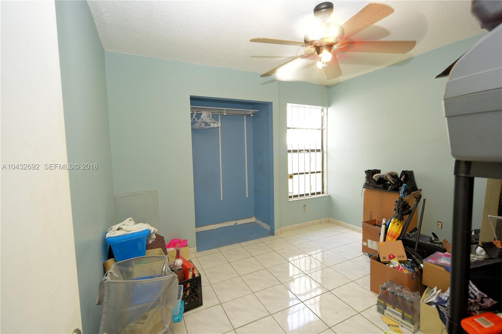 12193 Southwest 10th Street, Unit 1 Miami, FL 33184 - Photo 13 of 16 a room with furniture and a window