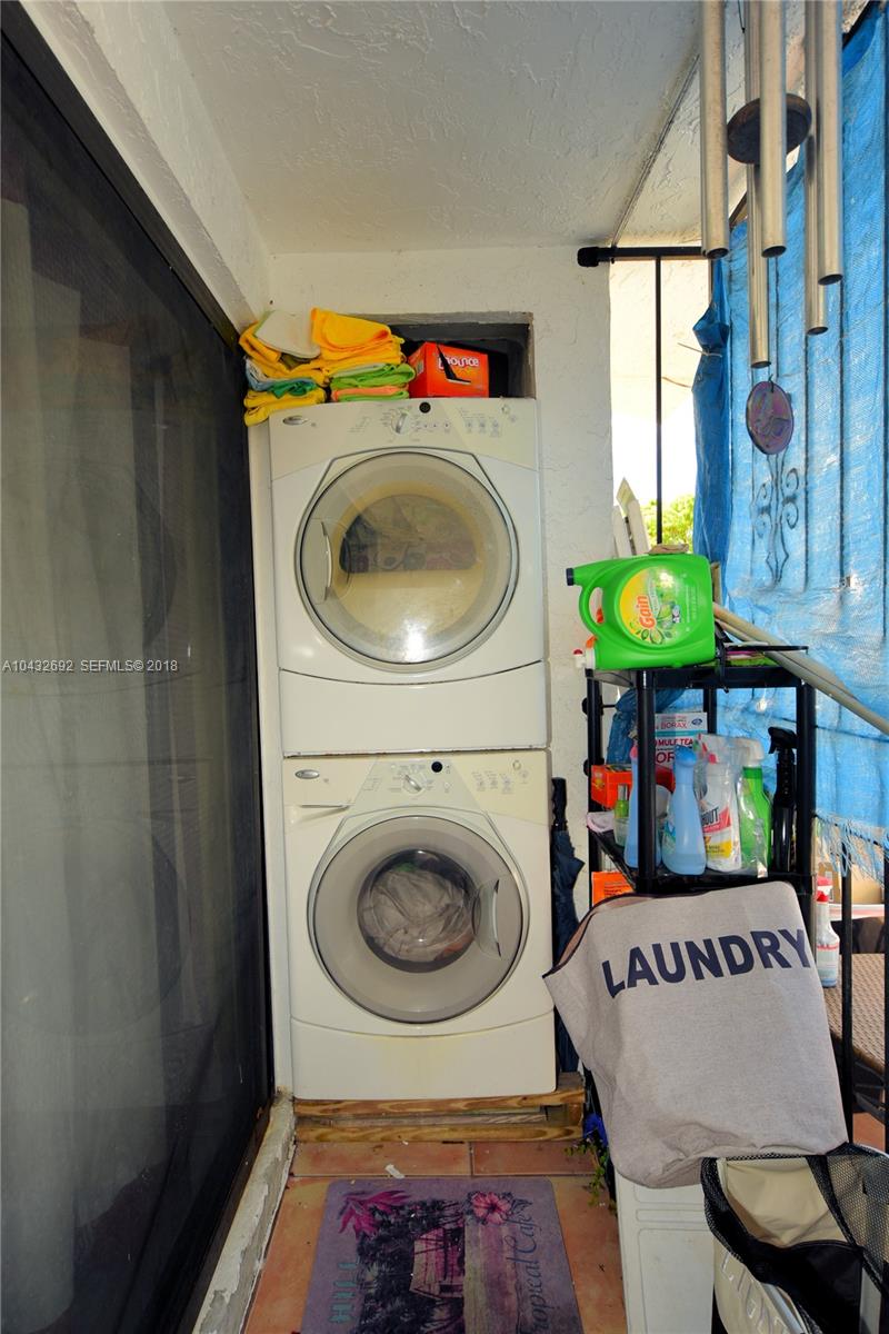 12193 Southwest 10th Street, Unit 1 Miami, FL 33184 - Photo 14 of 16 a utility room with dryer and washer
