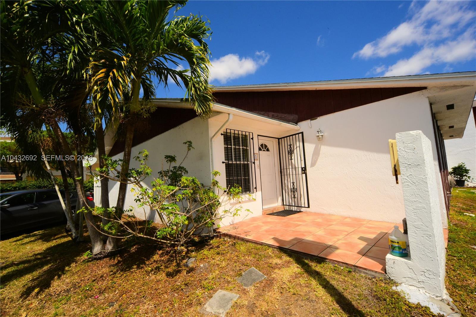 12193 Southwest 10th Street, Unit 1 Miami, FL 33184 - Photo 15 of 16 a view of a house with a patio
