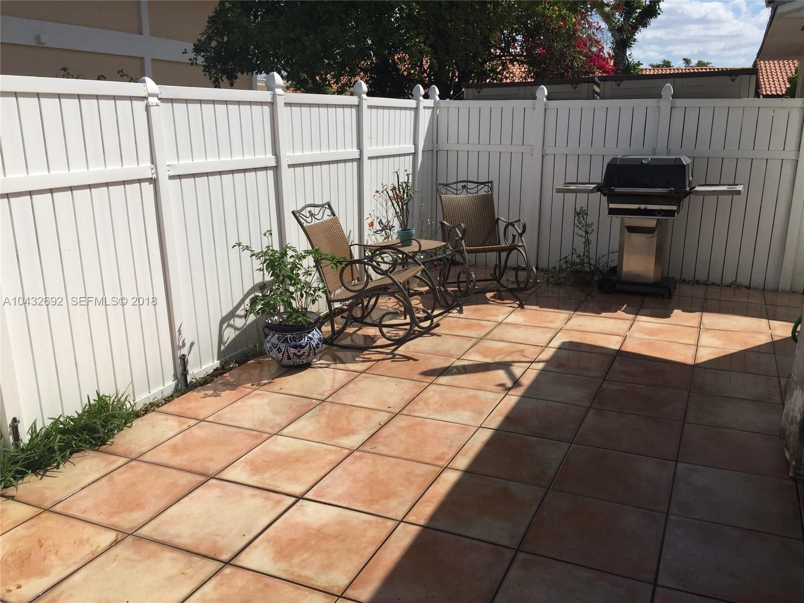 12193 Southwest 10th Street, Unit 1 Miami, FL 33184 - Photo 16 of 16 a view of outdoor space with seating area