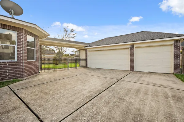 a view of a brick house with a outdoor space