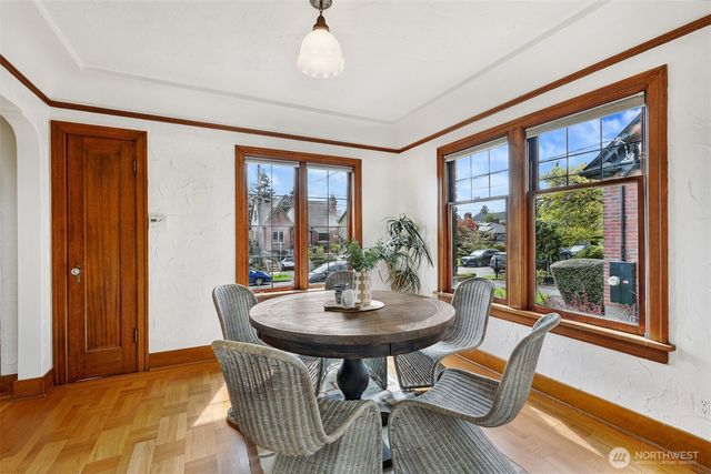 a view of a dining room with furniture window and outside view