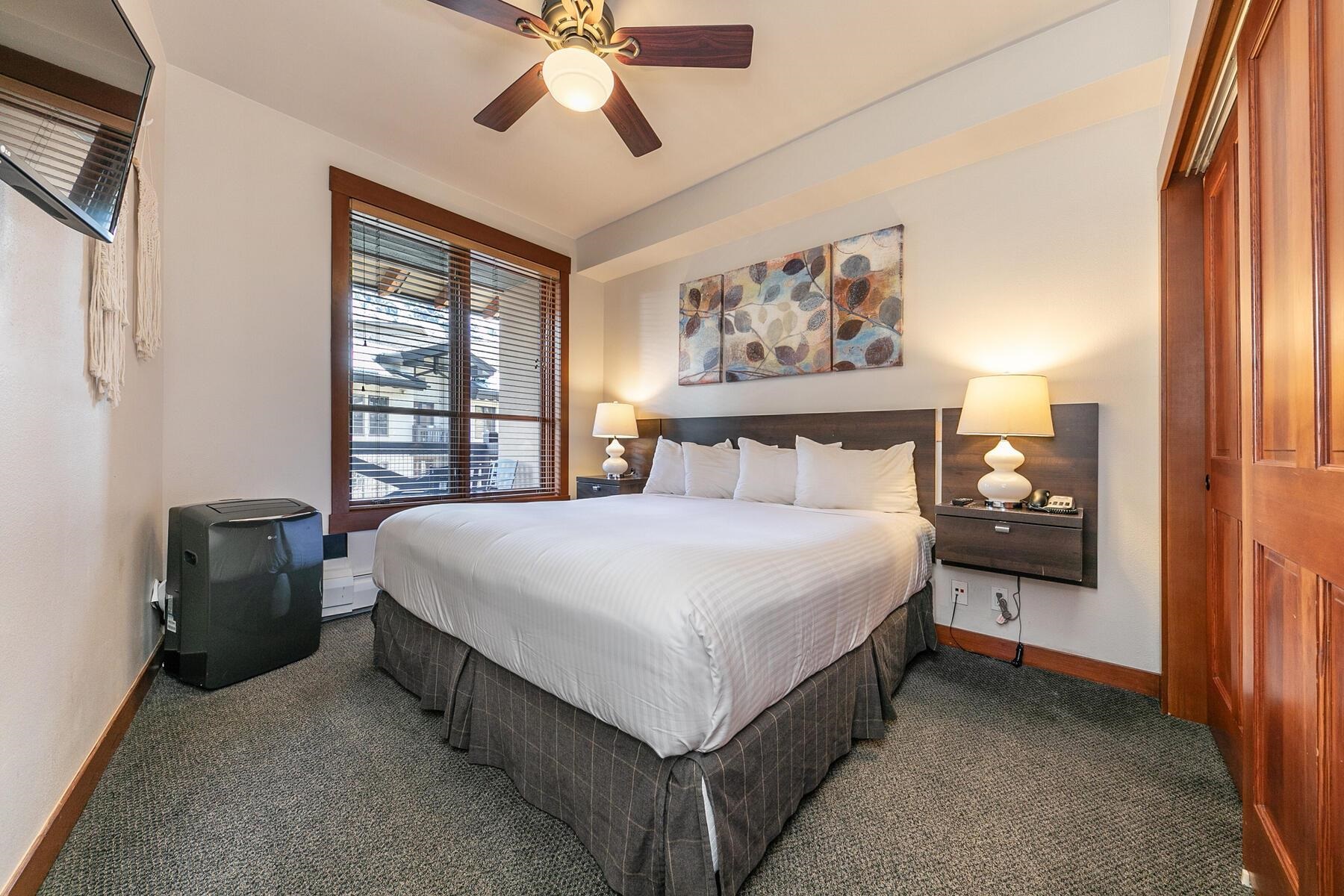 1750 Village East Road, Unit 5418 Olympic Valley, CA 96146 - Photo 15 of 21 a bedroom with a bed and a chandelier