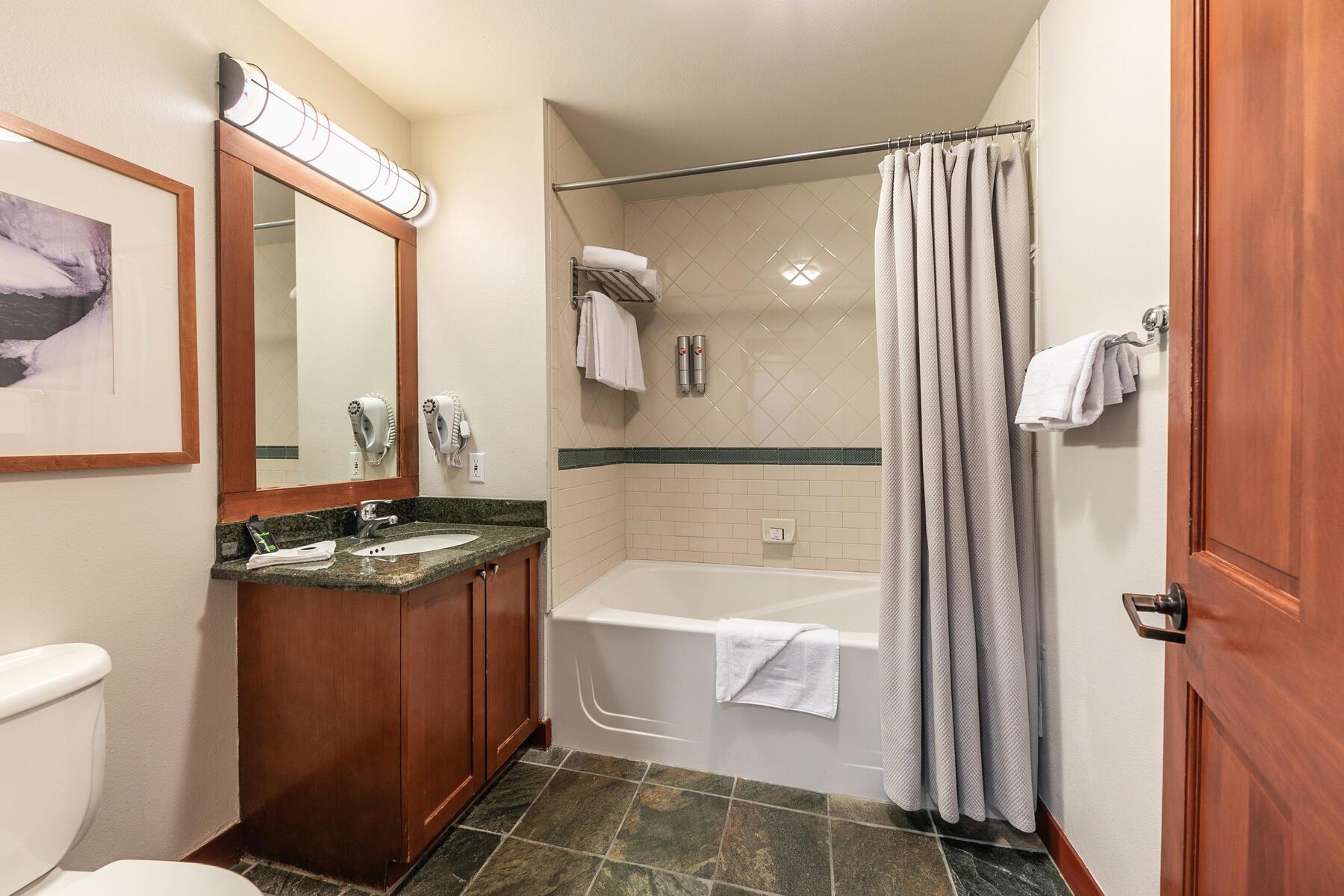 1750 Village East Road, Unit 5418 Olympic Valley, CA 96146 - Photo 16 of 21 a bathroom with a granite countertop sink toilet and shower