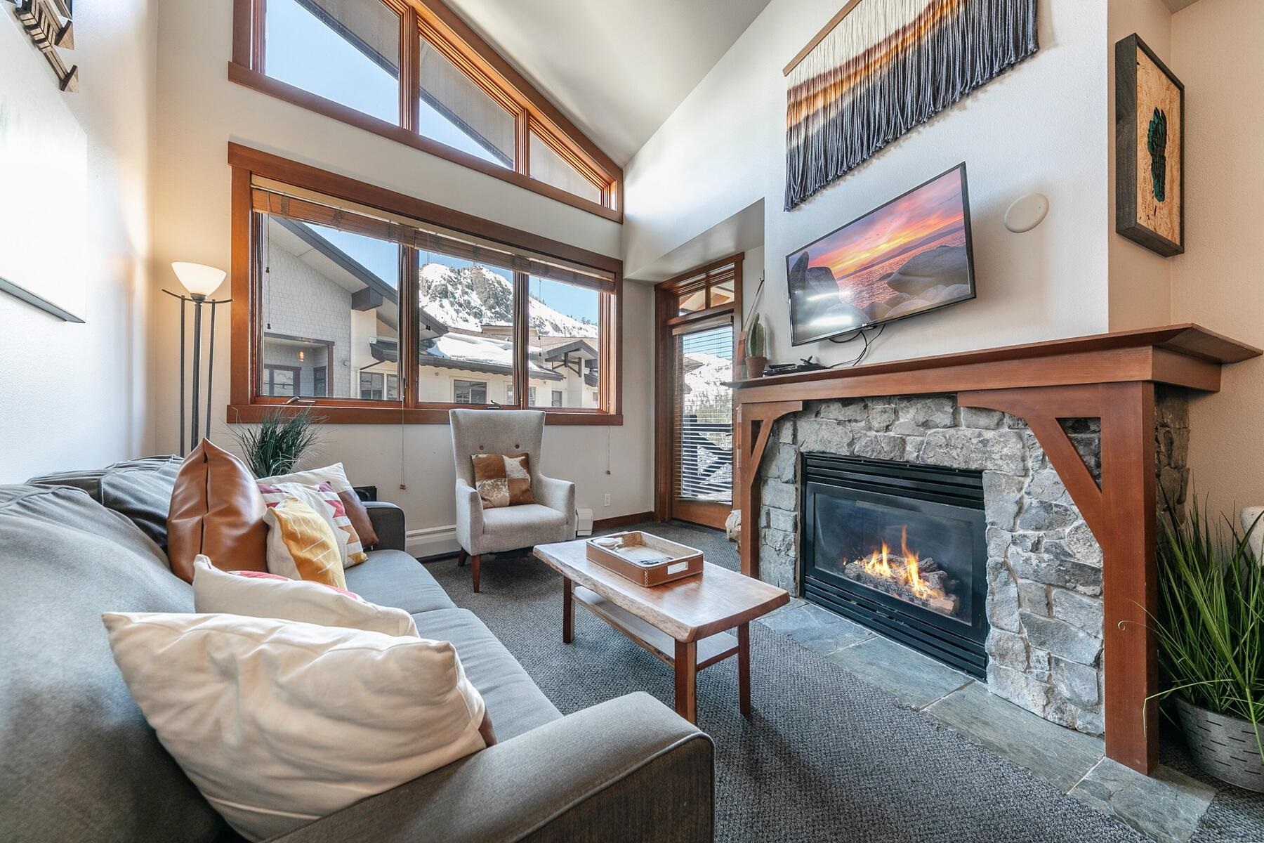 1750 Village East Road, Unit 5418 Olympic Valley, CA 96146 - Photo 2 of 21 a living room with furniture and a fireplace