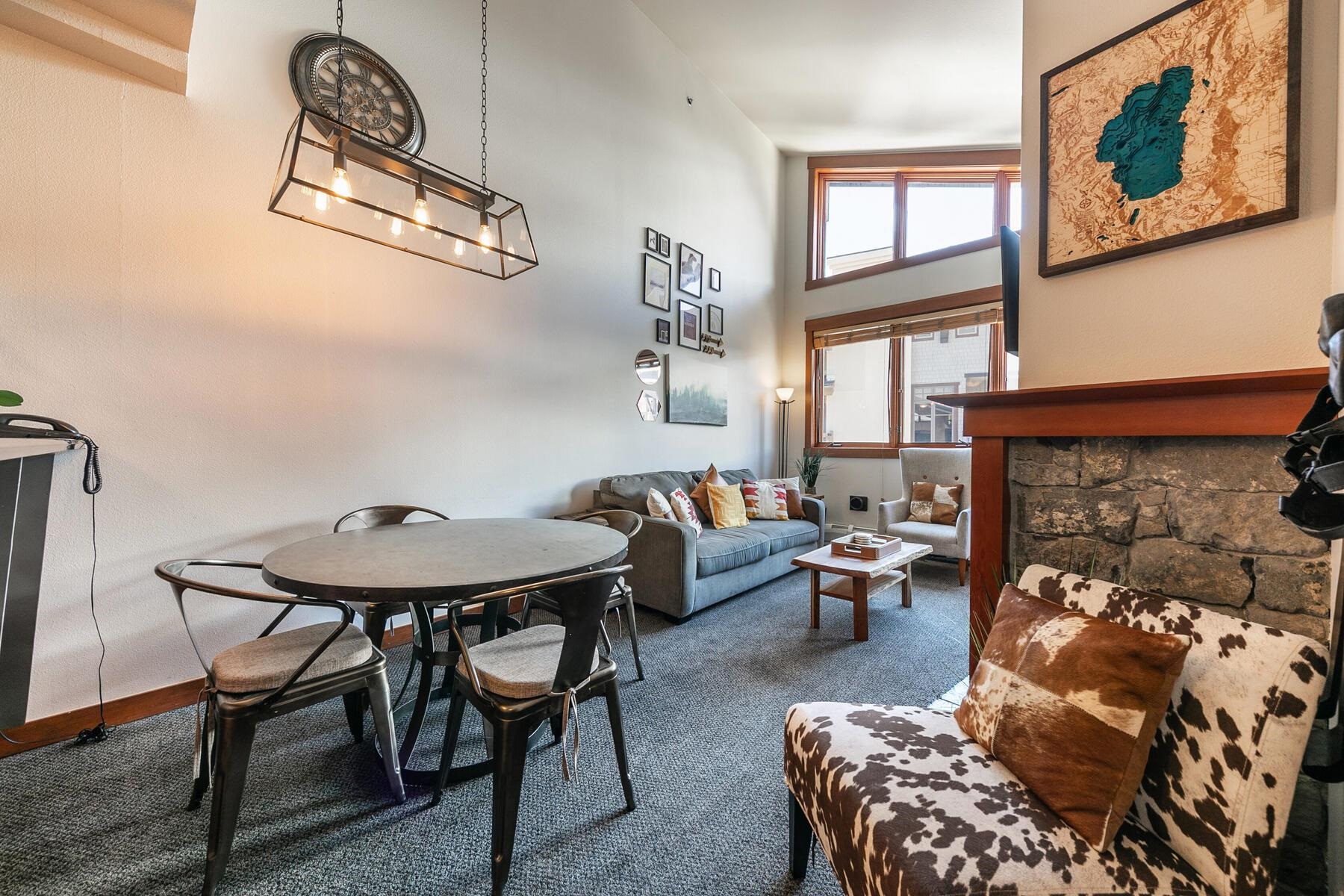 1750 Village East Road, Unit 5418 Olympic Valley, CA 96146 - Photo 6 of 21 a living room with furniture and a fireplace