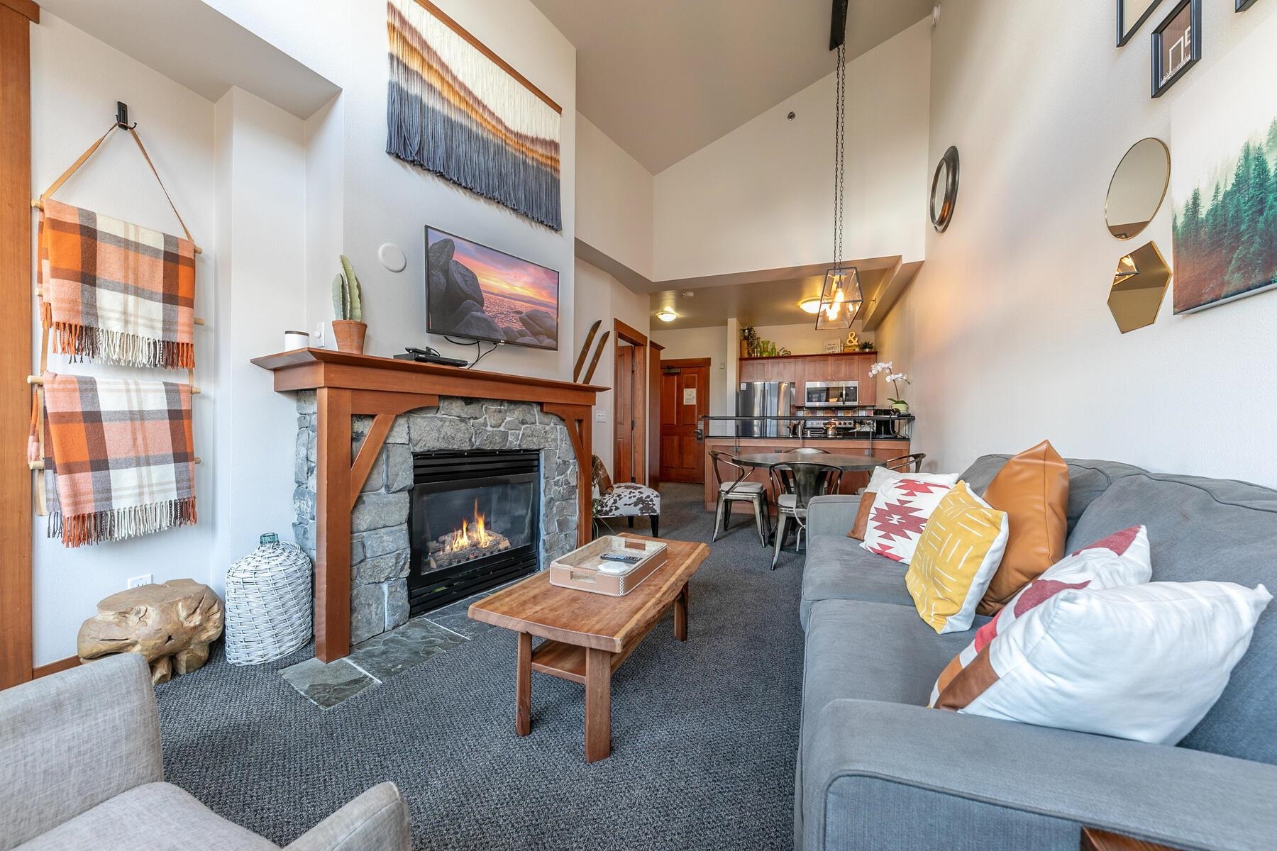 1750 Village East Road, Unit 5418 Olympic Valley, CA 96146 - Photo 7 of 21 a living room with furniture and a fireplace