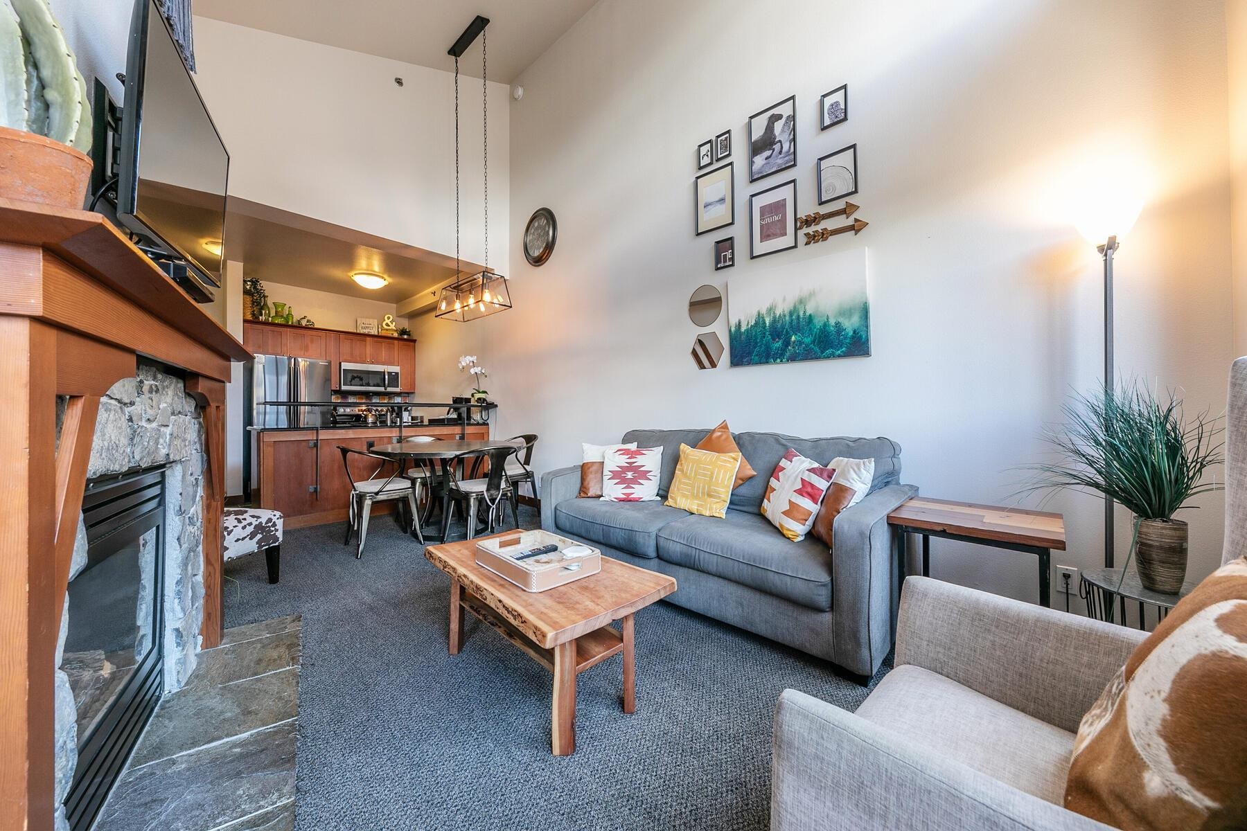 1750 Village East Road, Unit 5418 Olympic Valley, CA 96146 - Photo 8 of 21 a living room with furniture and a fireplace