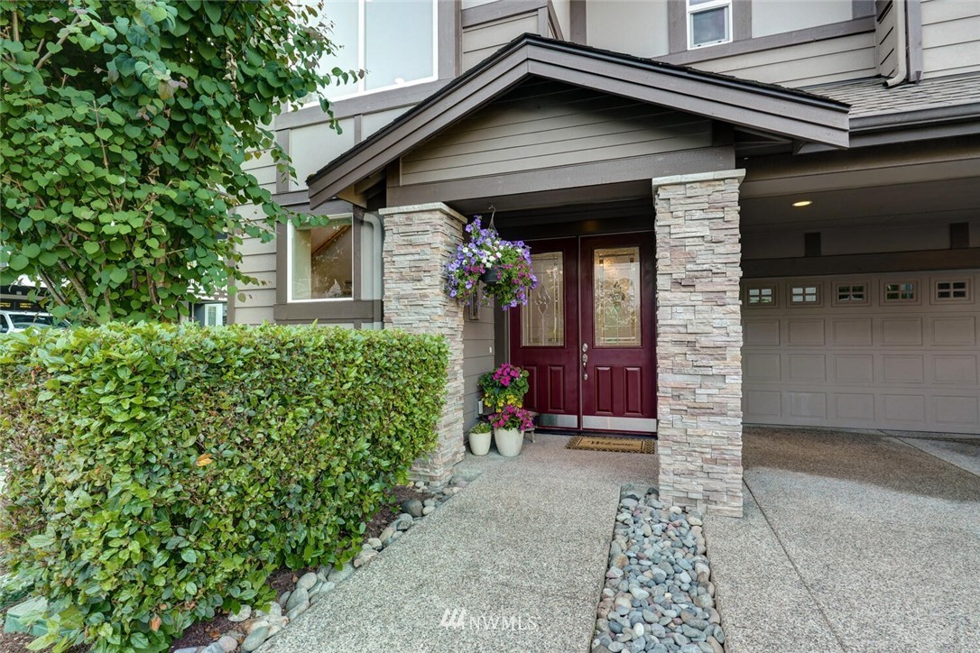 19622 94th Avenue Northeast, Unit 38 Bothell, WA 98011 - Photo 2 of 30 a view of a house with potted plants