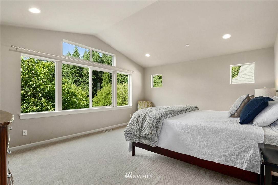 19622 94th Avenue Northeast, Unit 38 Bothell, WA 98011 - Photo 11 of 30 a bed sitting in a spacious bedroom next to a window