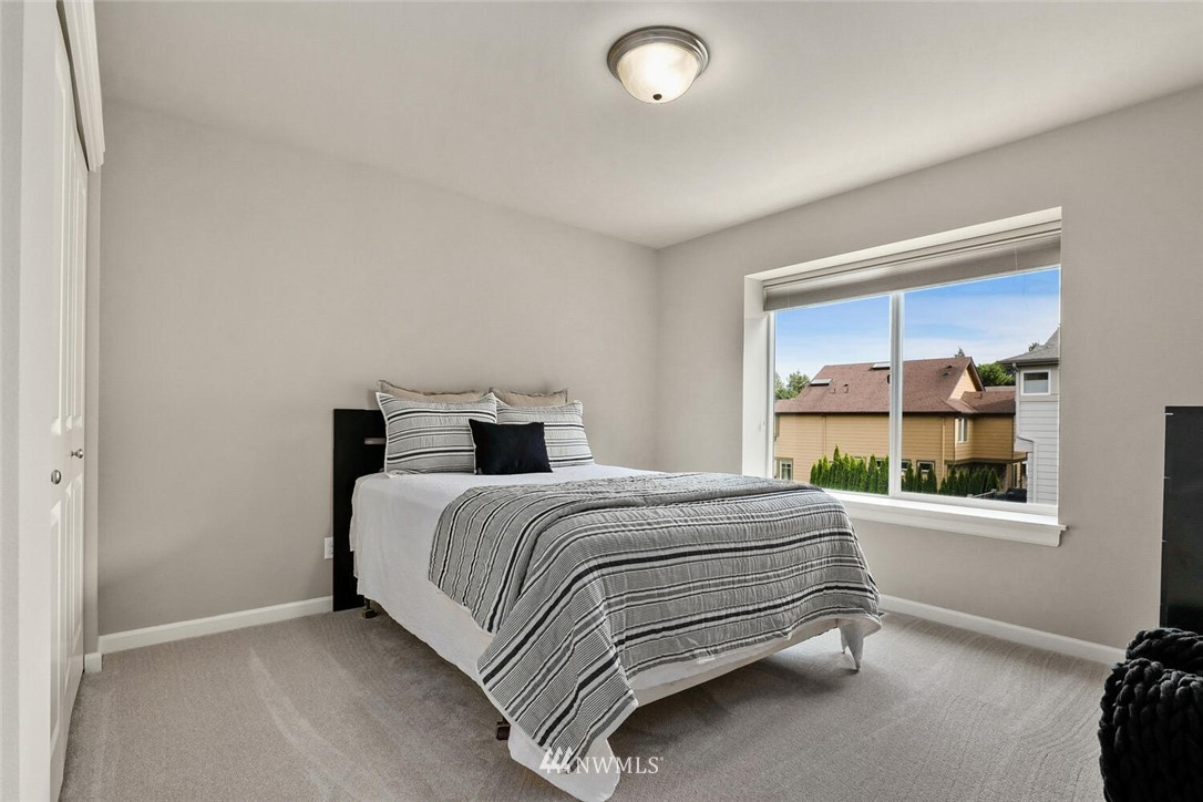 19622 94th Avenue Northeast, Unit 38 Bothell, WA 98011 - Photo 16 of 30 a bedroom with a bed and a window