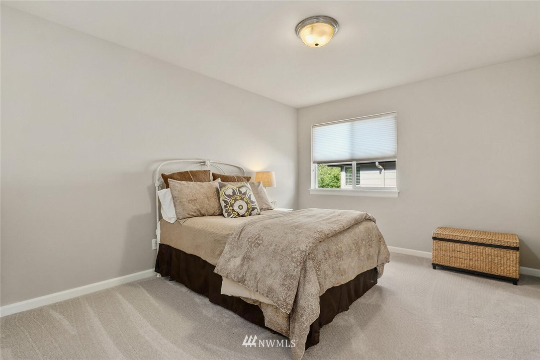 19622 94th Avenue Northeast, Unit 38 Bothell, WA 98011 - Photo 18 of 30 a bedroom with a bed and a window