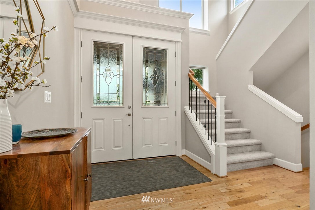 19622 94th Avenue Northeast, Unit 38 Bothell, WA 98011 - Photo 3 of 30 a view of a hallway with entryway wooden floor and front door