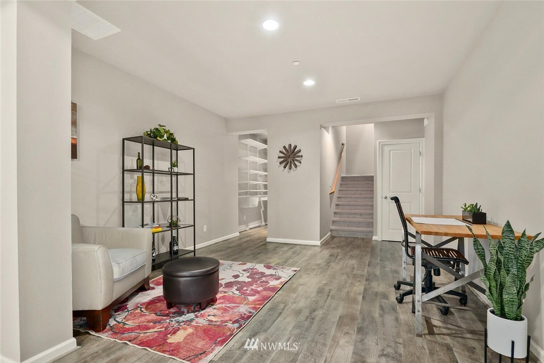 19622 94th Avenue Northeast, Unit 38 Bothell, WA 98011 - Photo 24 of 30 a living room with furniture and a potted plant