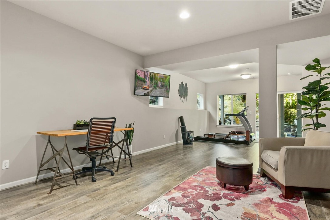 19622 94th Avenue Northeast, Unit 38 Bothell, WA 98011 - Photo 26 of 30 a living room with furniture a window and a table