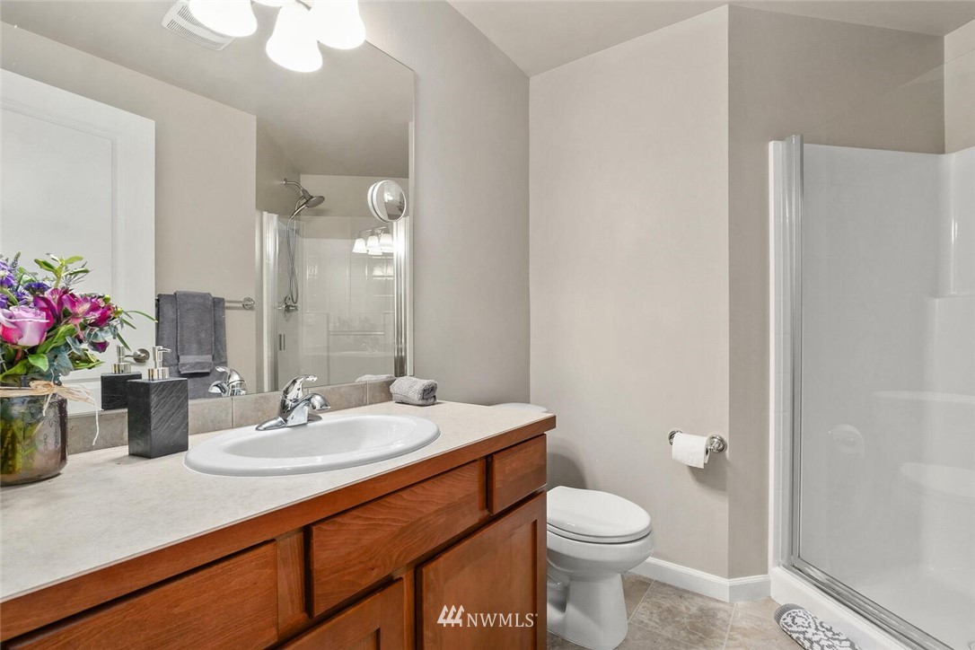 19622 94th Avenue Northeast, Unit 38 Bothell, WA 98011 - Photo 28 of 30 a bathroom with a sink a toilet and a mirror
