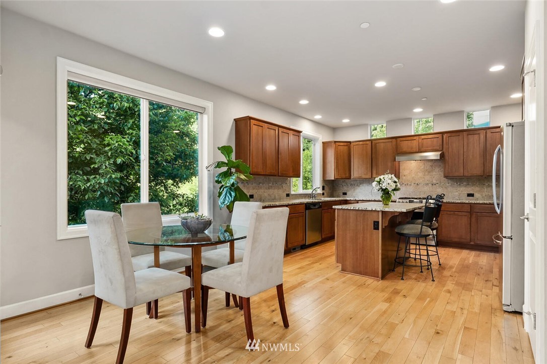 19622 94th Avenue Northeast, Unit 38 Bothell, WA 98011 - Photo 6 of 30 a view of a dining room with furniture window and wooden floor