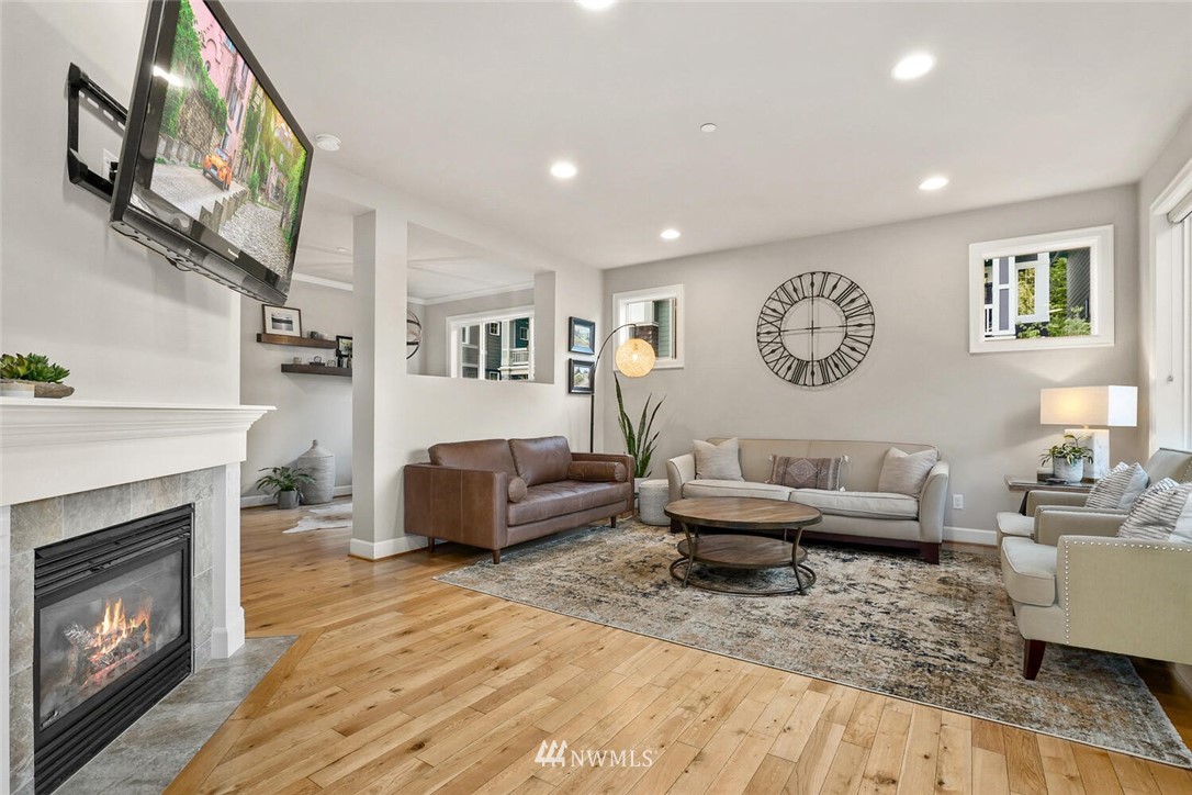 19622 94th Avenue Northeast, Unit 38 Bothell, WA 98011 - Photo 7 of 30 a living room with furniture and a fireplace