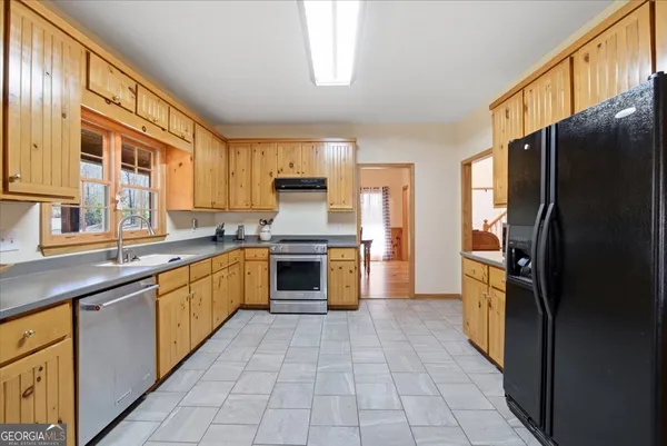 a living room with furniture fireplace and flat screen tv