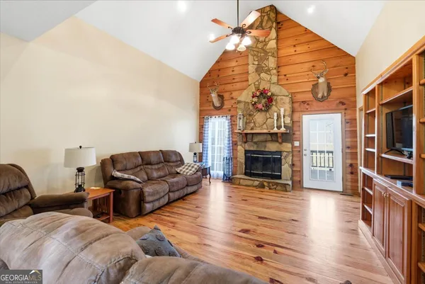 a dining room with furniture and wooden floor