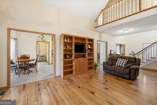 a view of a dining room with furniture window and wooden floor