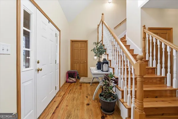 a white bath tub sitting in a bathroom next to a window
