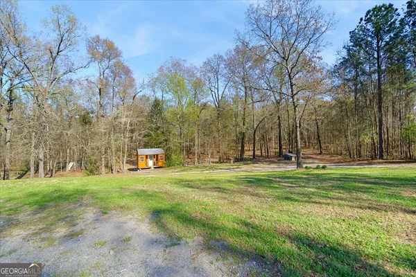 a view of a tree front of a house
