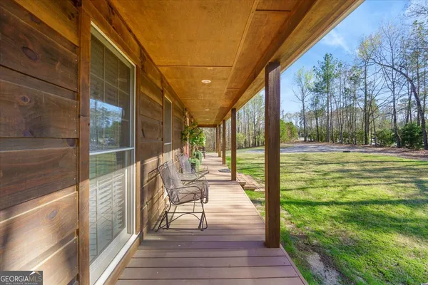 a dining room with furniture and window