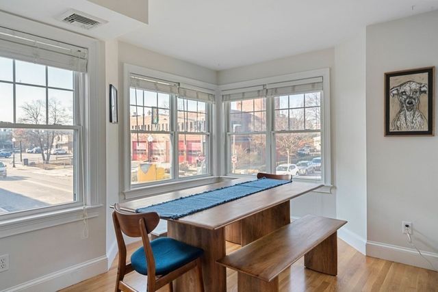 a dining room with a table and chairs