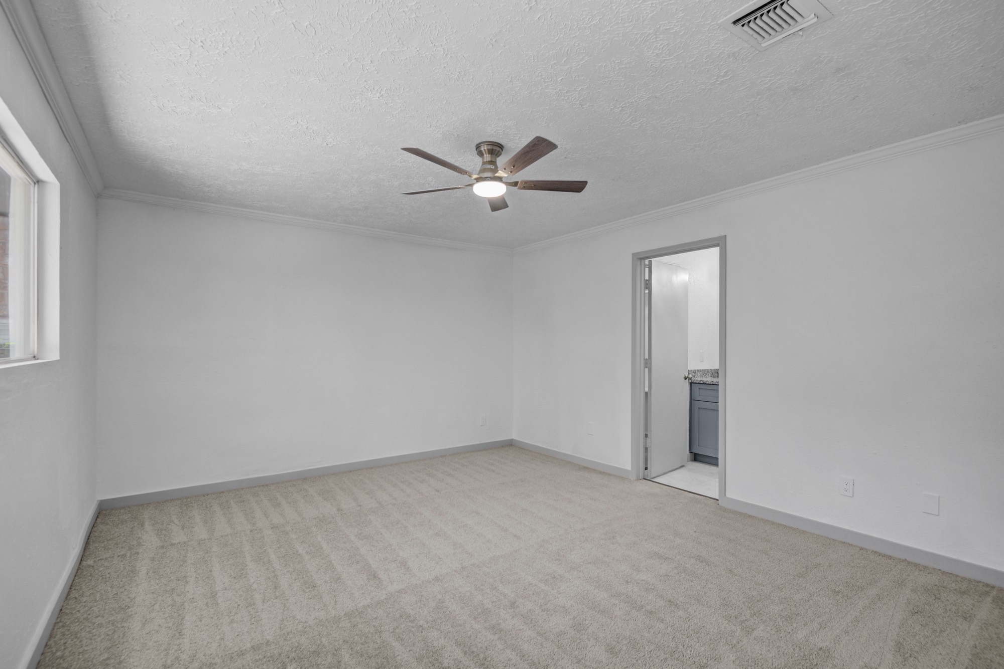 13747 Rampchester Lane Houston, TX 77015 - Photo 14 of 24 an empty room with closet and a ceiling fan