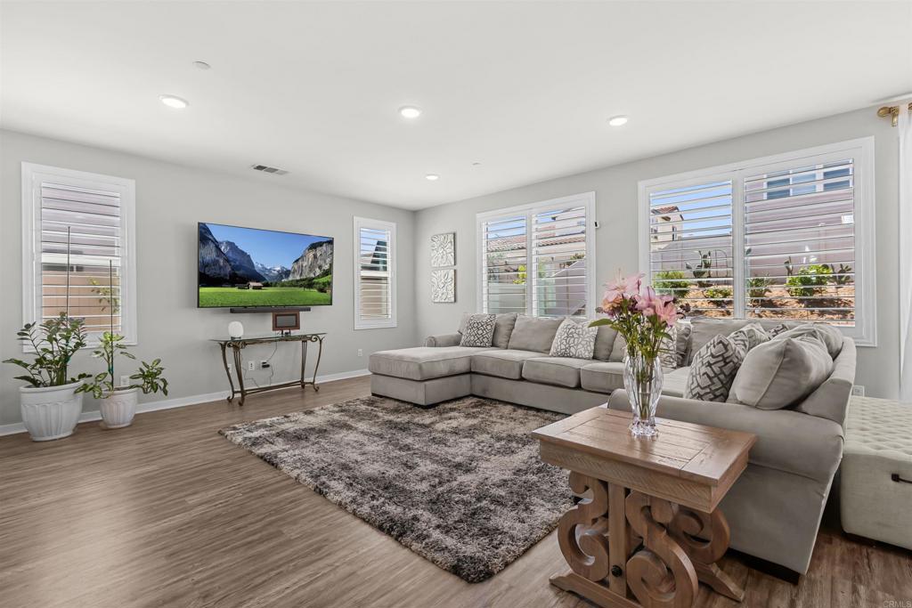 29809 Gypsy Vanner Way Menifee, CA 92584 - Photo 10 of 45 a living room with furniture and a flat screen tv