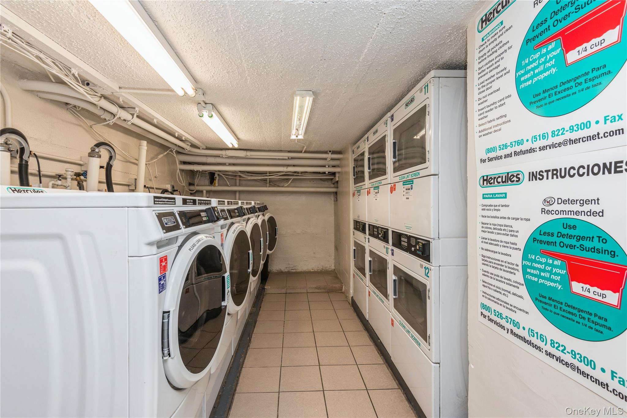 310 Riverside Boulevard, Unit 2C Long Beach, NY 11561 - Photo 21 of 21 a utility room with dryer and washer