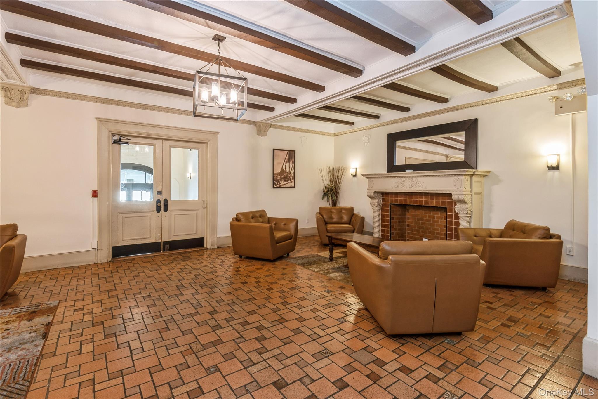 310 Riverside Boulevard, Unit 2C Long Beach, NY 11561 - Photo 4 of 21 a living room with furniture and a fireplace