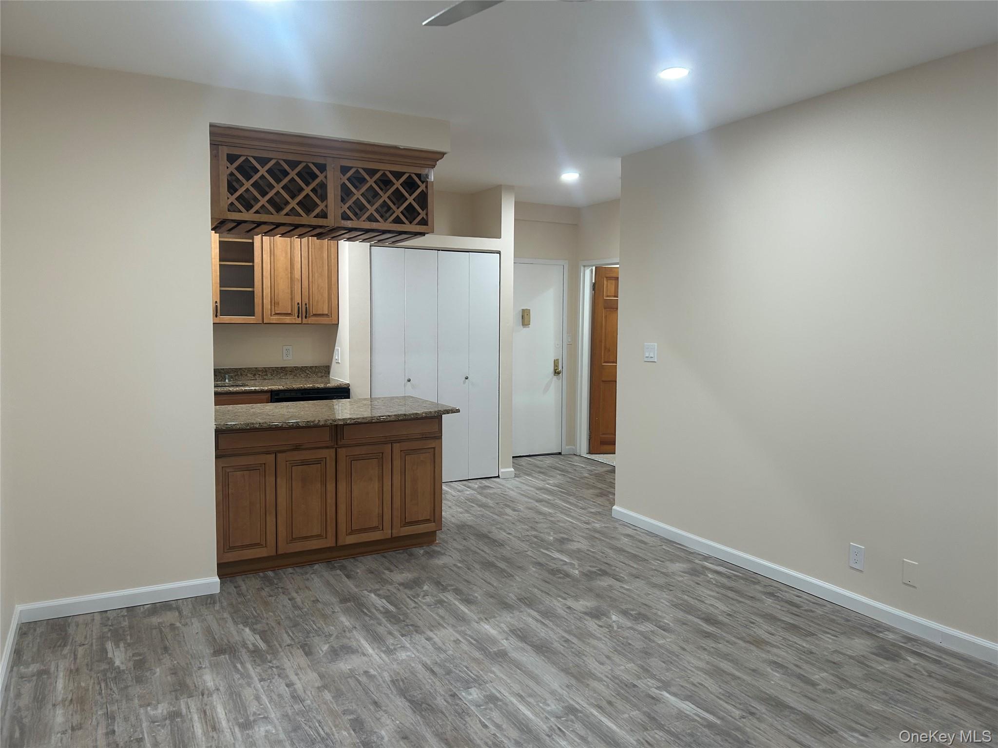 310 Riverside Boulevard, Unit 2C Long Beach, NY 11561 - Photo 8 of 21 a view of kitchen with wooden floor