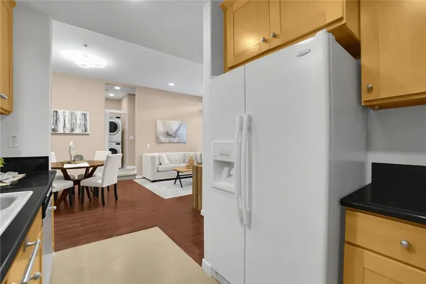 a living room with furniture a rug and a window