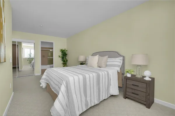 a bedroom with a bed and window