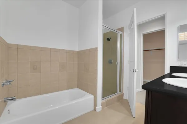 a bathroom with a bathtub and a sink
