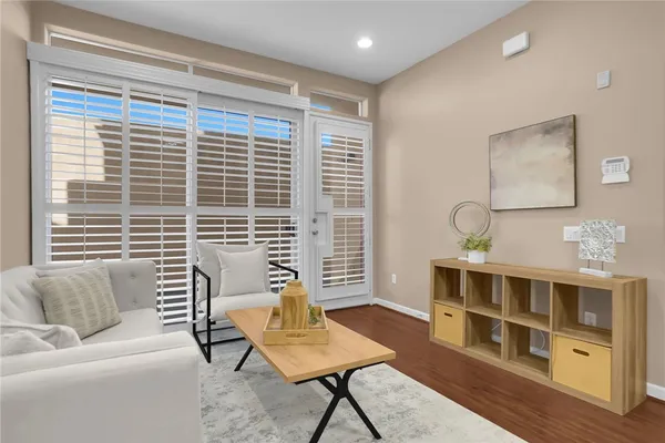 a view of a livingroom with furniture and a window