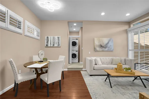 a living room with furniture and a rug