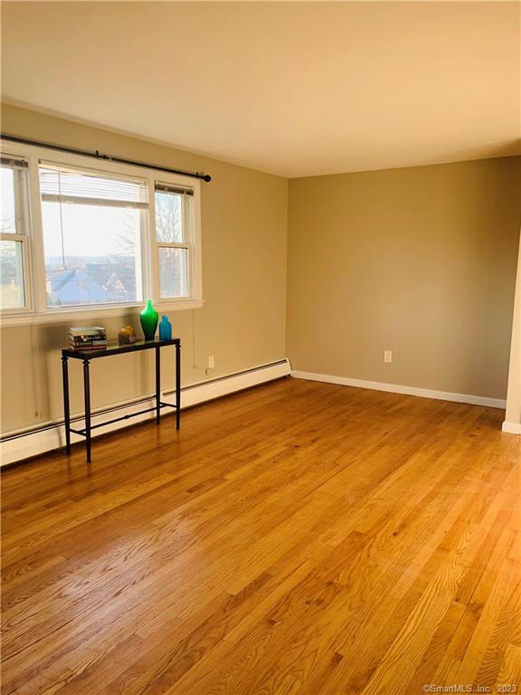 280 Lighthouse Road New Haven, CT 06512 - Photo 11 of 21 a view of an empty room with wooden floor and a window