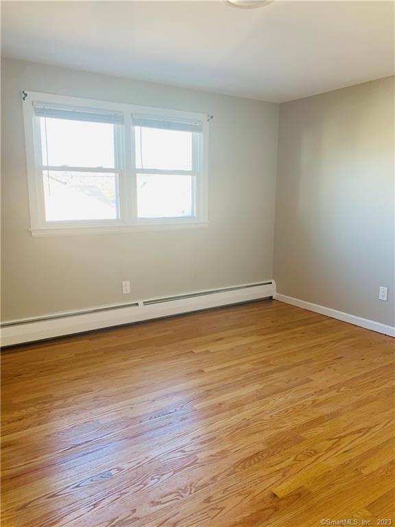 280 Lighthouse Road New Haven, CT 06512 - Photo 16 of 21 a view of an empty room with wooden floor and a window