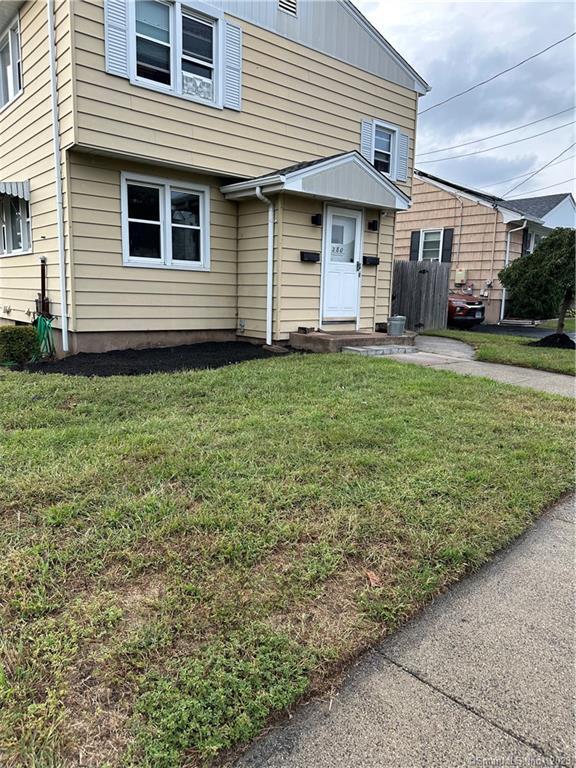 280 Lighthouse Road New Haven, CT 06512 - Photo 2 of 21 a front view of a house with garden